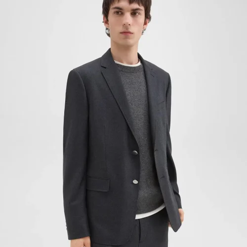 Nostrand Blazer in Charcoal Melange – Slim-fit stretch flannel for men, featuring notched lapels and flap pockets.